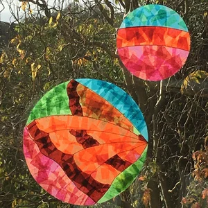 Completed stained glass tissue design - butterfly and bauble
