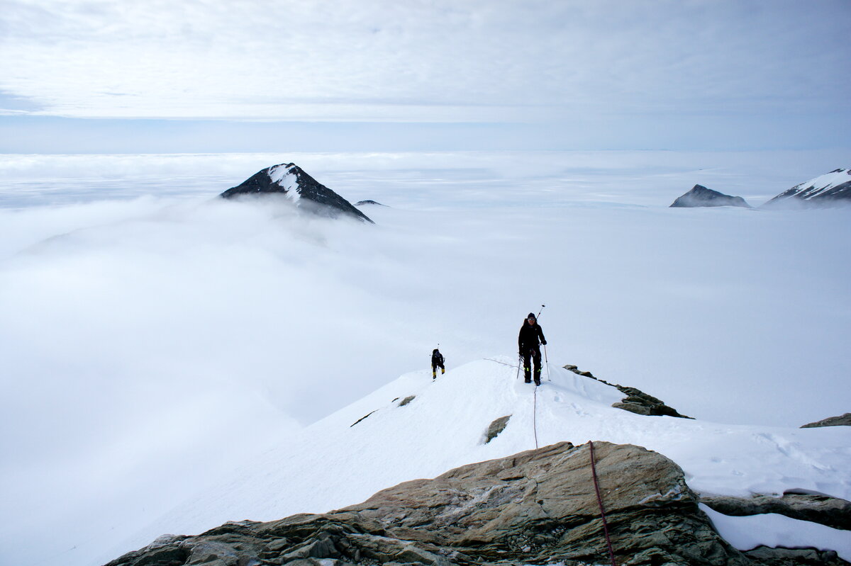 Climbing above the fog on east ridge of Mount Rossman