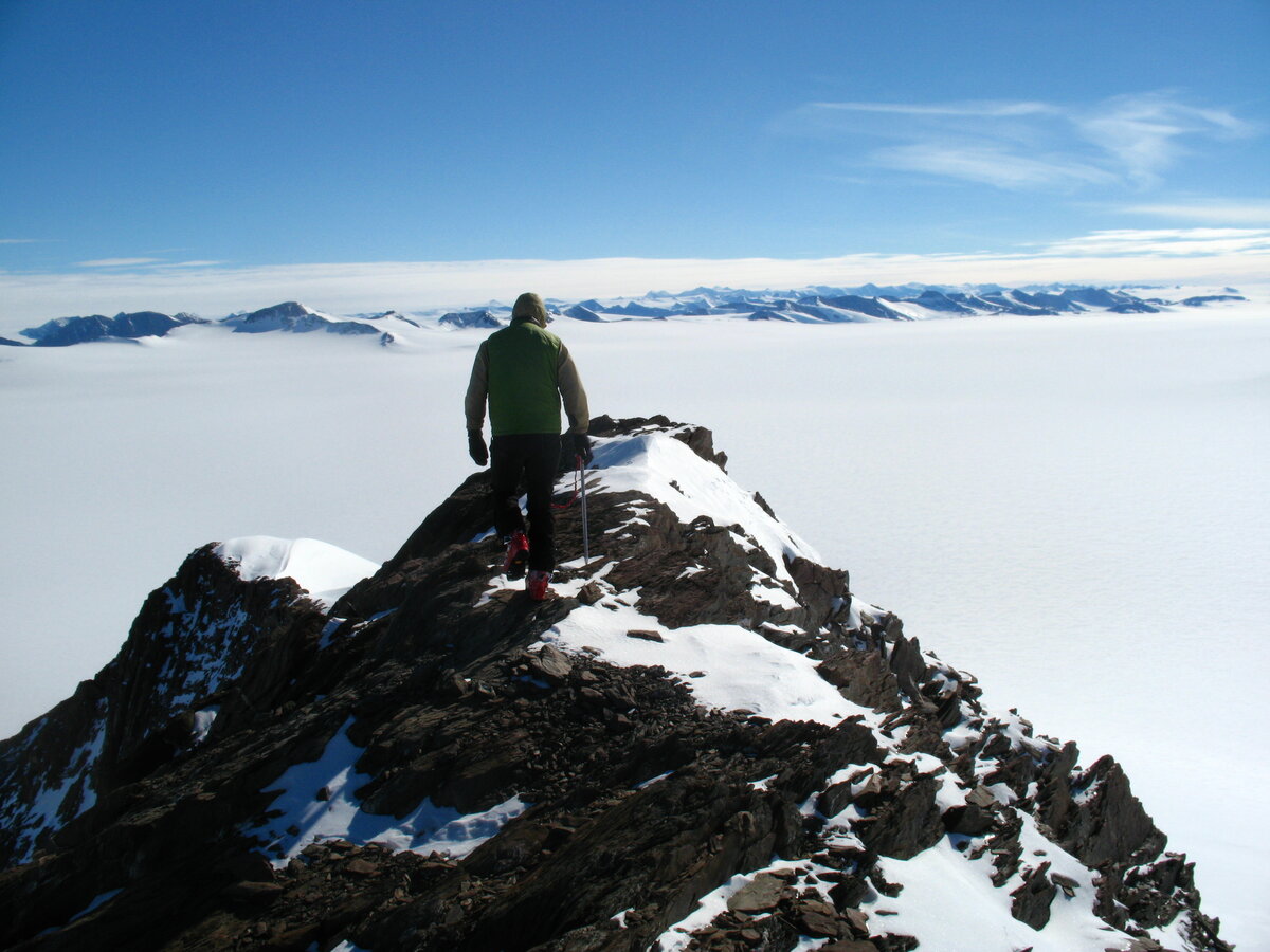 Climber traverses Driscoll Ridge overlooking Schanz Glacier