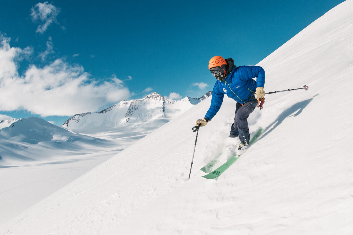 A skier descends the slope above Three Glaciers