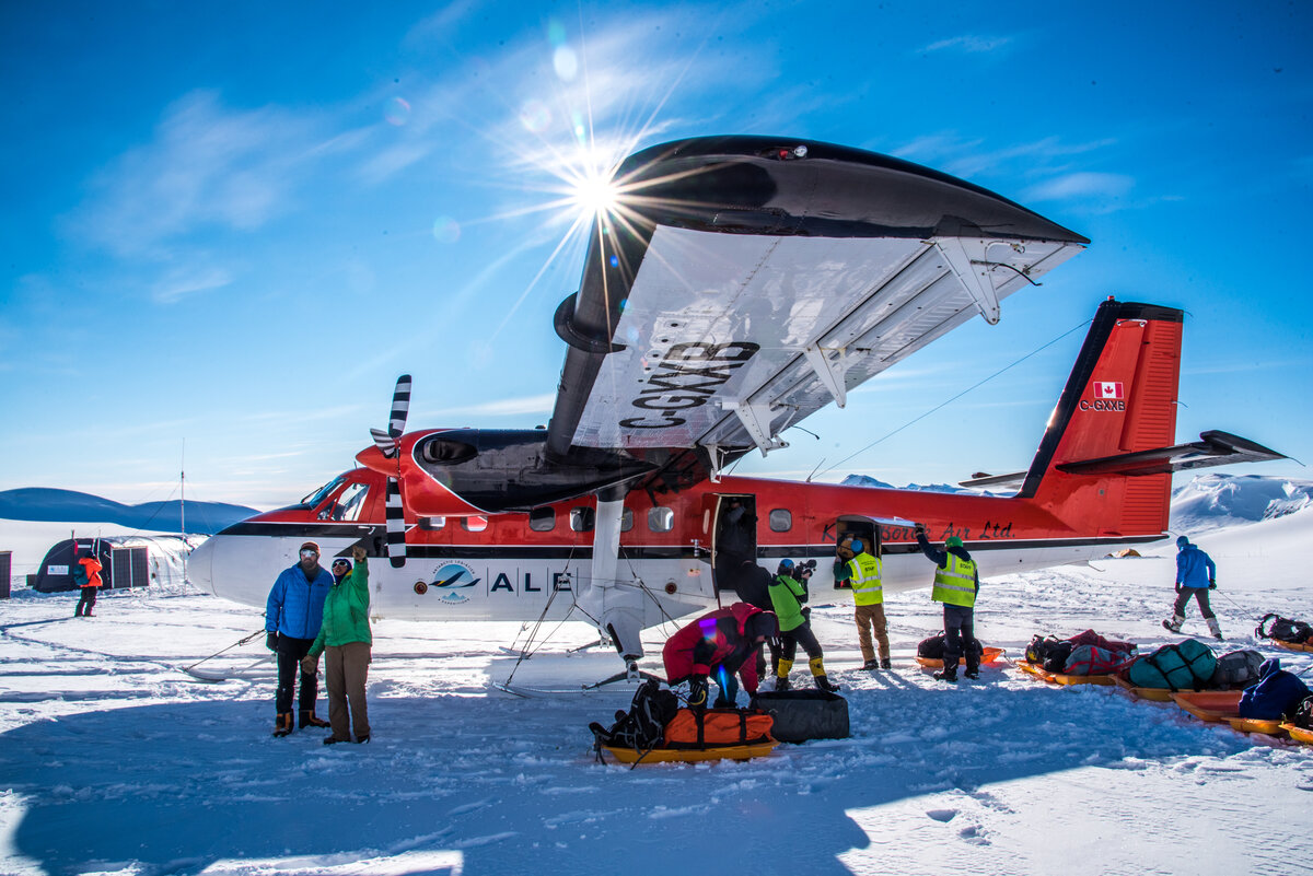 ALE staff load expedition sleds into a Twin Otter